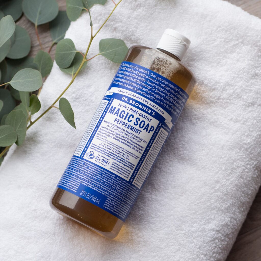 Dr. Bronner's Castile Magic Soap on a towel on the floor.