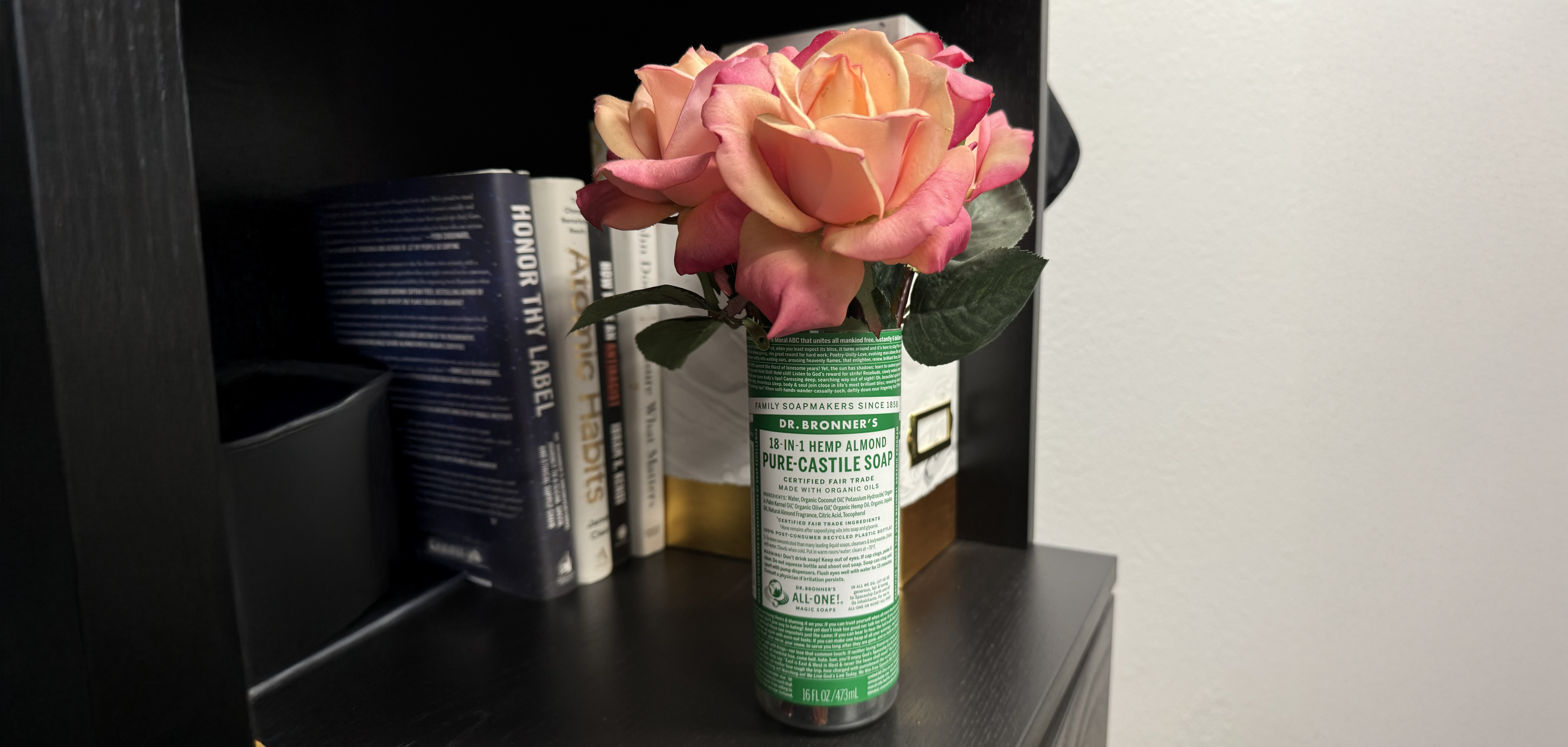 Dr. Bronner's Castile bottle with flowers in it.