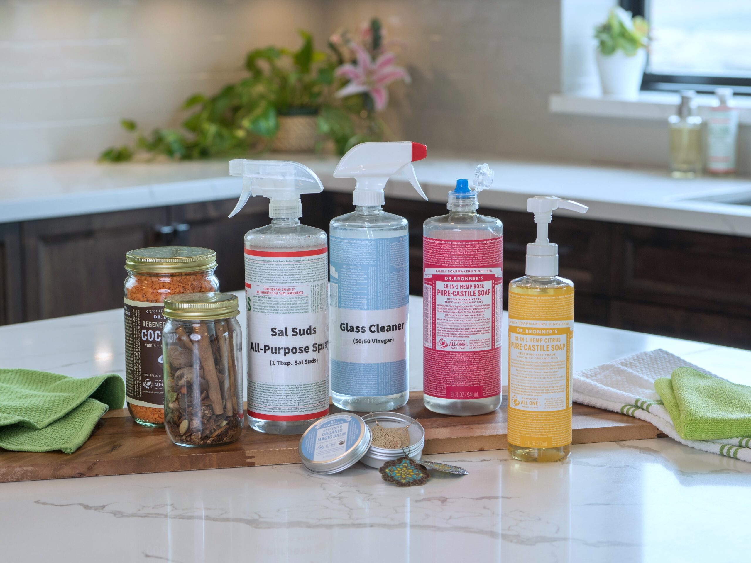 Repurposed Dr. Bronner's containers laid out on counter.