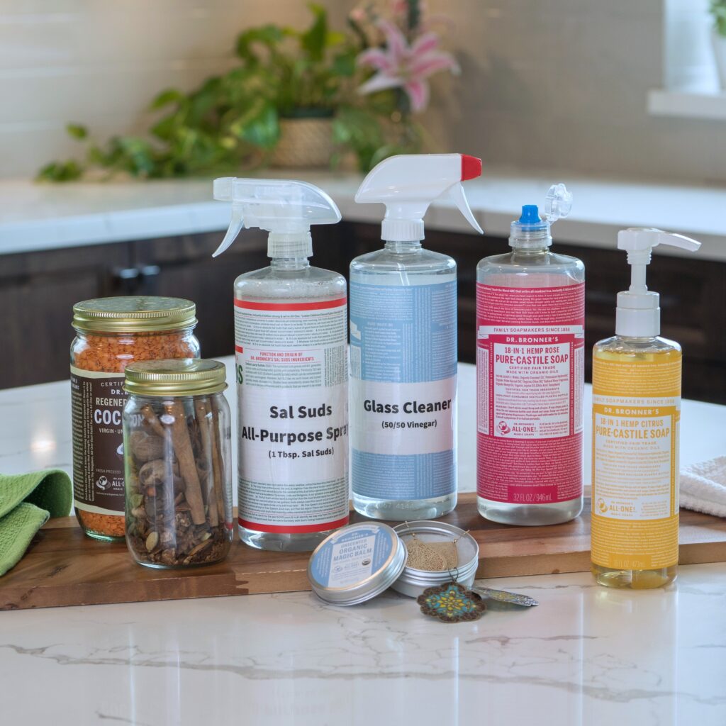 Repurposed Dr. Bronner's containers laid out on counter.